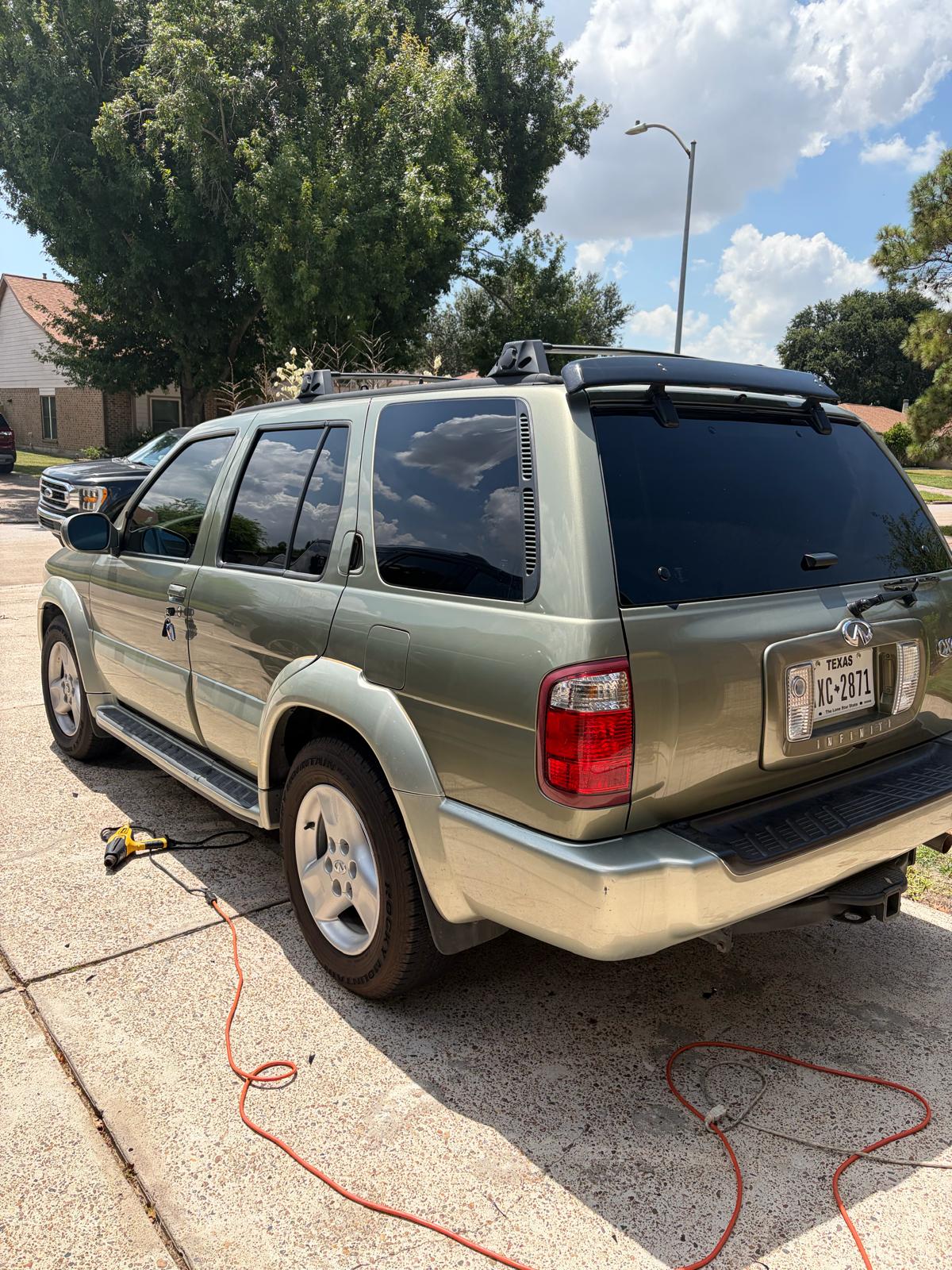 Ceramic tint being professionally applied to a sedan