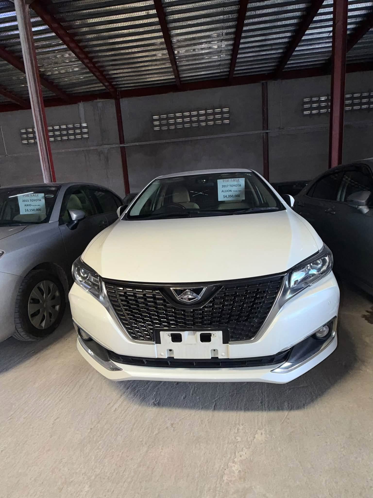 2017 Toyota Allion Pearl White — front view showing bold black grille and LED headlights