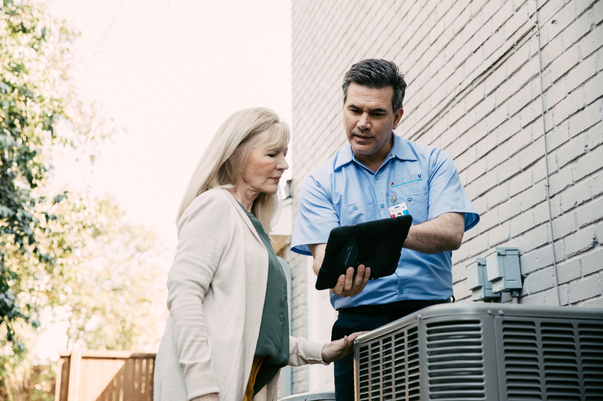 Aire Serv technician with customer