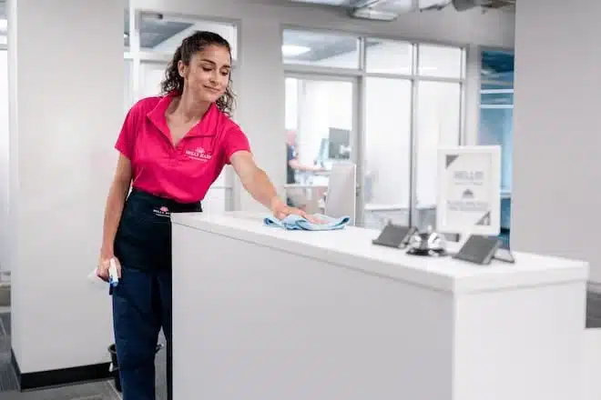 Molly Maid professional at reception desk