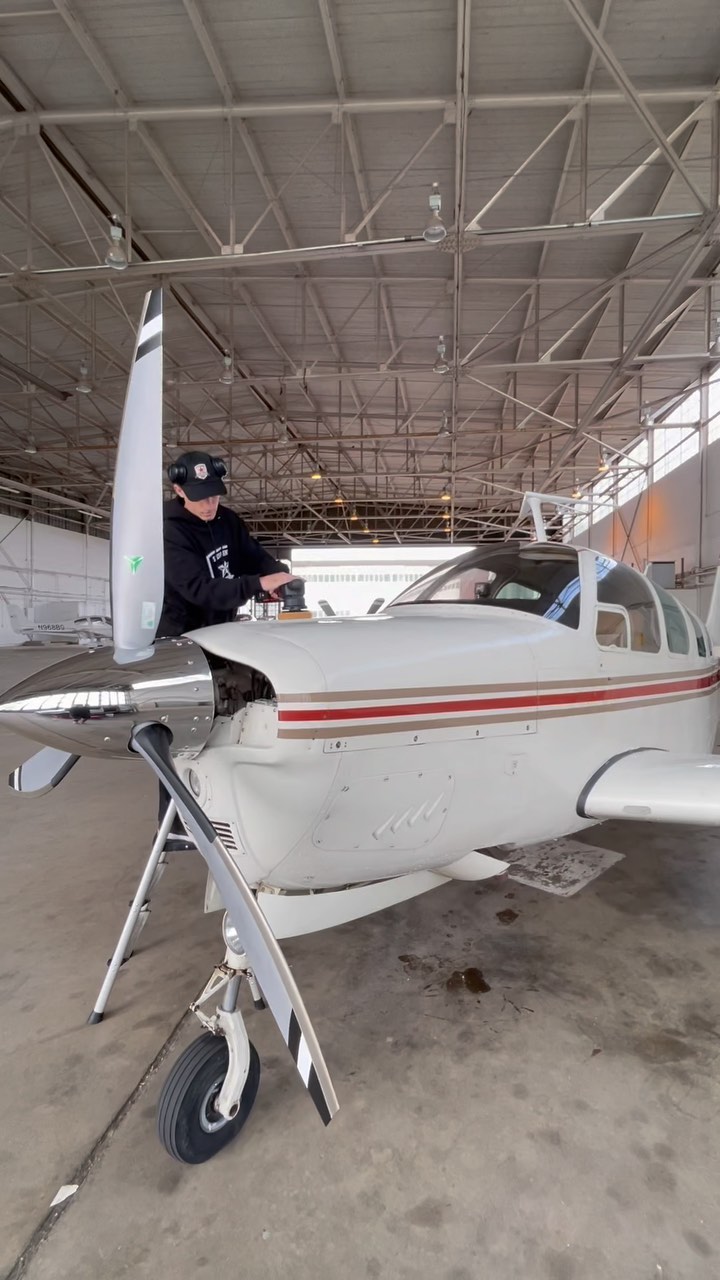 Aircraft cleaning technician polishing the exterior of a private aircraft