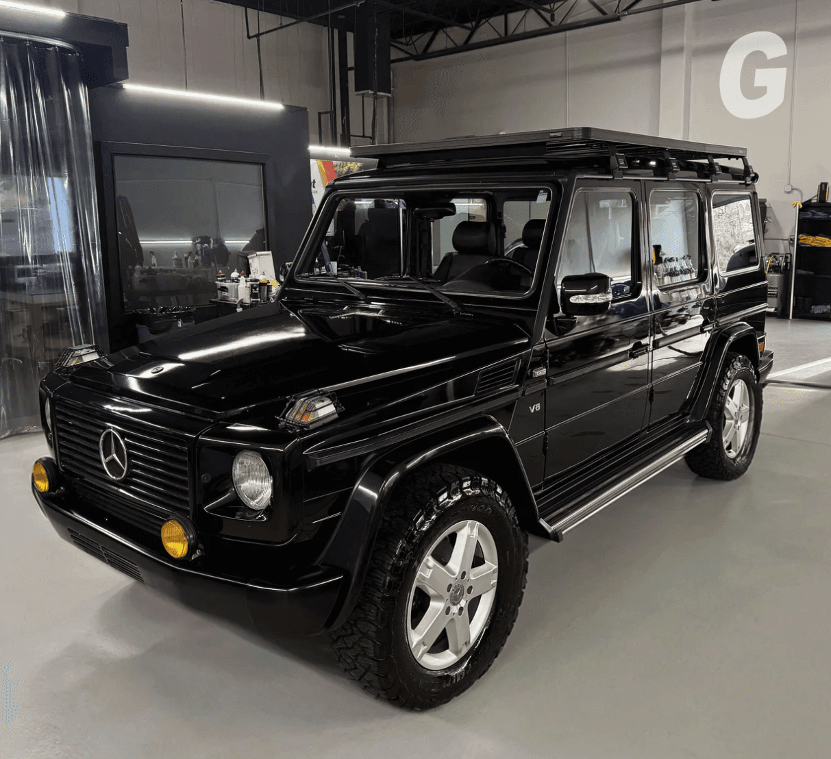 Black Mercedes G-Class SUV in showroom